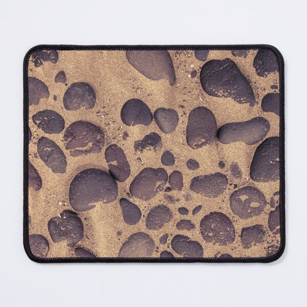 Item preview, Directly above shot of lava stones in the sand designed and sold by kristofbellens.
