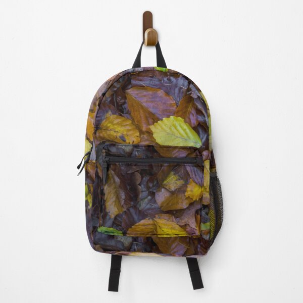 Item preview, Directly above shot of mixed autumn leaves with yellow, brown and green colors on the forest soil designed and sold by kristofbellens.
