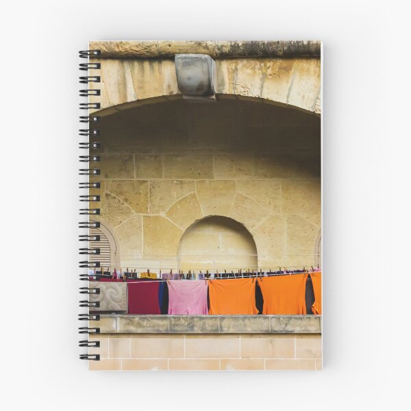 Item preview, Colorful Laundry Hanging On Stone Balcony Under Arched Mediterranean Shuttered Windows designed and sold by Nmallia.