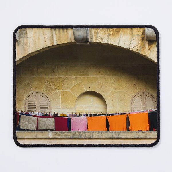 Item preview, Colorful Laundry Hanging On Stone Balcony Under Arched Mediterranean Shuttered Windows designed and sold by Nmallia.