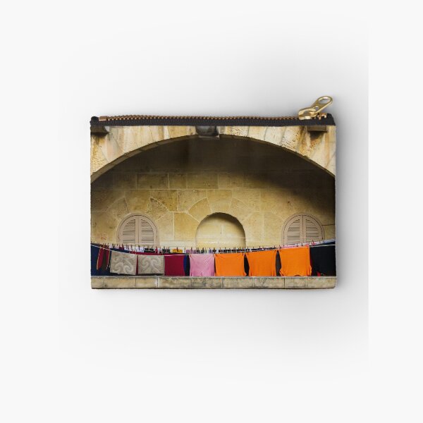 Item preview, Colorful Laundry Hanging On Stone Balcony Under Arched Mediterranean Shuttered Windows designed and sold by Nmallia.