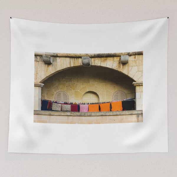 Item preview, Colorful Laundry Hanging On Stone Balcony Under Arched Mediterranean Shuttered Windows designed and sold by Nmallia.