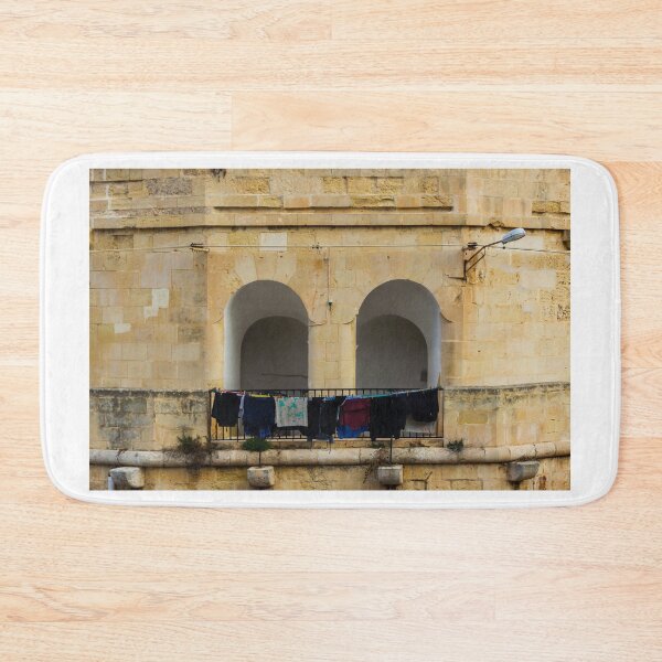 Item preview, Colorful Laundry Hanging On Stone Balcony Under Arched Mediterranean Shuttered Windows designed and sold by Nmallia.