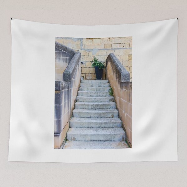 Item preview, Stone Staircase With Potted Plant Against Weathered Limestone Wall Leading Up Between Parapets designed and sold by Nmallia.