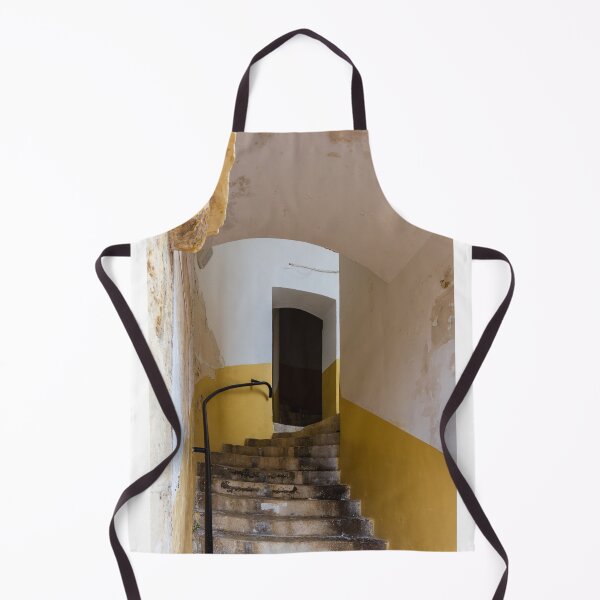 Item preview, Empty Yellow Stairwell With Worn Stone Steps And Black Metal Railing In Apartment Building designed and sold by Nmallia.