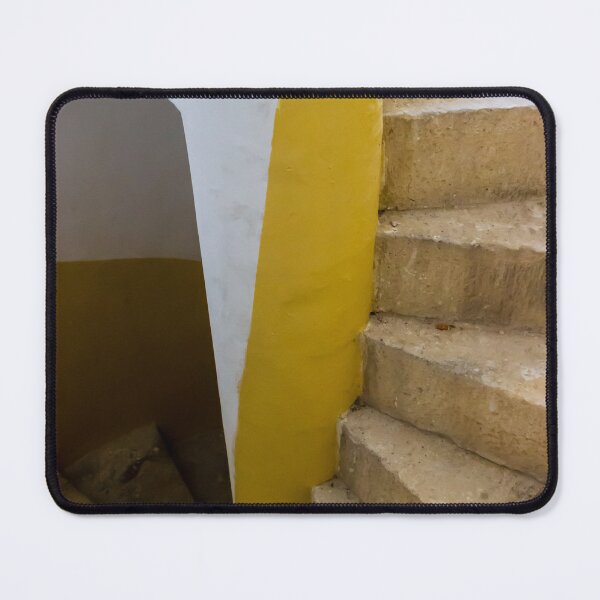 Item preview, Empty Yellow Stairwell With Worn Stone Steps And Black Metal Railing In Apartment Building designed and sold by Nmallia.