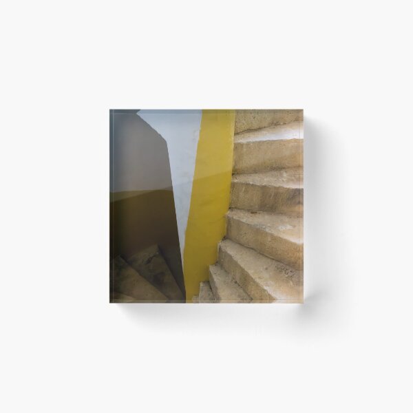 Item preview, Empty Yellow Stairwell With Worn Stone Steps And Black Metal Railing In Apartment Building designed and sold by Nmallia.