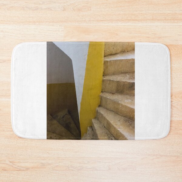 Item preview, Empty Yellow Stairwell With Worn Stone Steps And Black Metal Railing In Apartment Building designed and sold by Nmallia.
