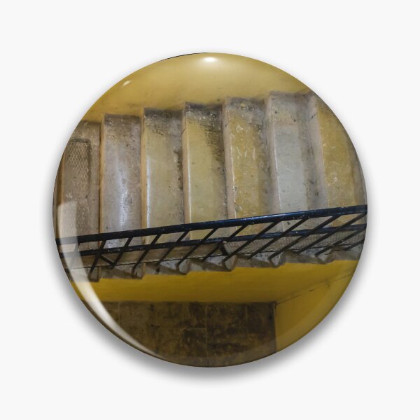 Item preview, Empty Yellow Stairwell With Worn Stone Steps And Black Metal Railing In Apartment Building designed and sold by Nmallia.