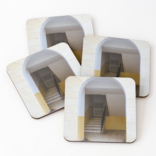 Item preview, Empty Yellow Stairwell With Worn Stone Steps And Black Metal Railing In Apartment Building designed and sold by Nmallia.