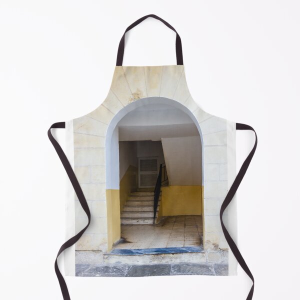 Item preview, Empty Yellow Stairwell With Worn Stone Steps And Black Metal Railing In Apartment Building designed and sold by Nmallia.