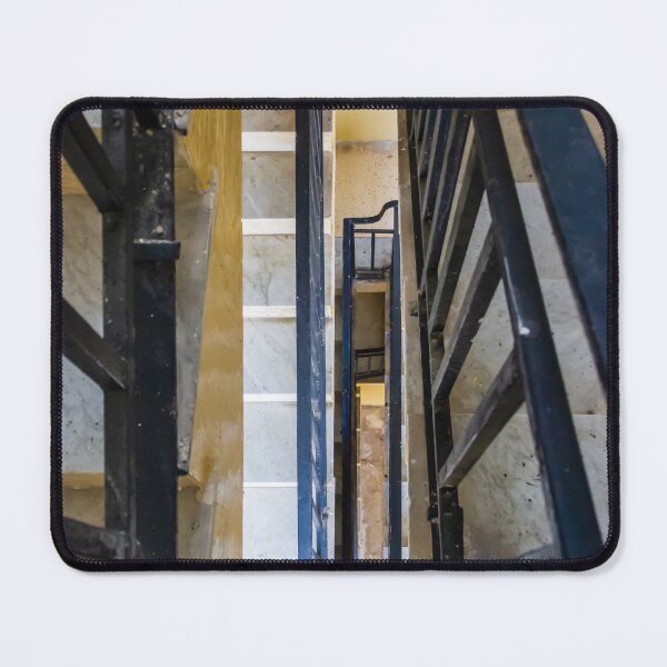 Item preview, Vertical Stairwell Perspective Looking Down Narrow Metal Railing Staircase in Apartment Building Interior designed and sold by Nmallia.