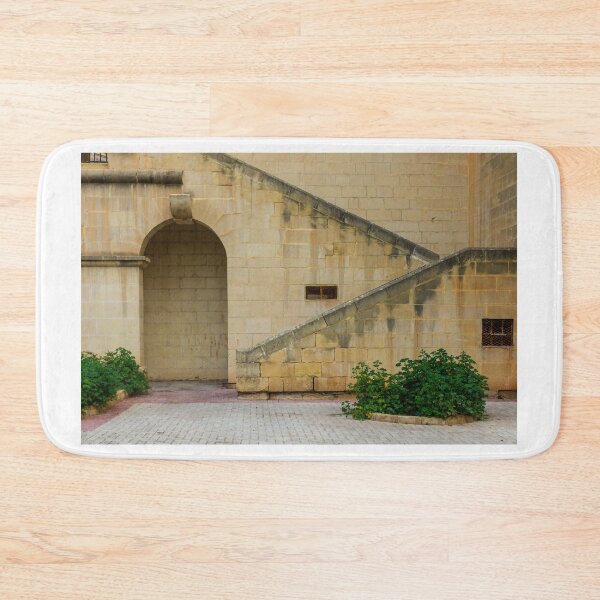Item preview, Historic Limestone Staircase And Arched Courtyard Wall With Green Shrubs And Paved Pathway designed and sold by Nmallia.