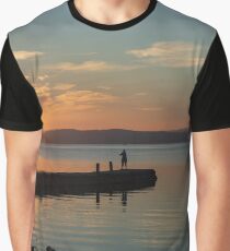 Fisherman in silhouette on the Pontile Degli Spagnoli at dawn, Castiglione del Lago, Umbria, Italy Graphic T-Shirt