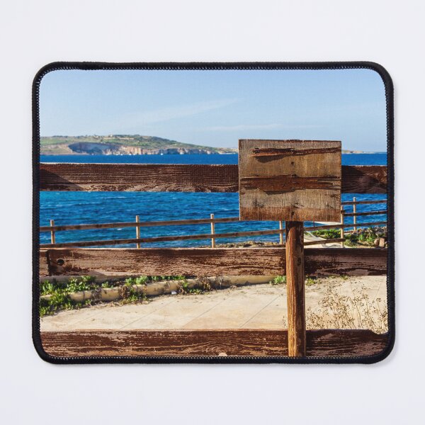 Item preview, Weathered Wooden Fence Overlooking Blue Sea and Distant Coastal Landscape on Sunny Day designed and sold by Nmallia.