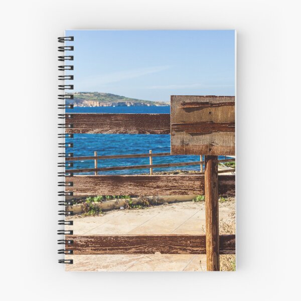 Item preview, Weathered Wooden Fence Overlooking Blue Sea and Distant Coastal Landscape on Sunny Day designed and sold by Nmallia.