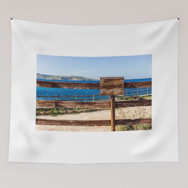 Item preview, Weathered Wooden Fence Overlooking Blue Sea and Distant Coastal Landscape on Sunny Day designed and sold by Nmallia.