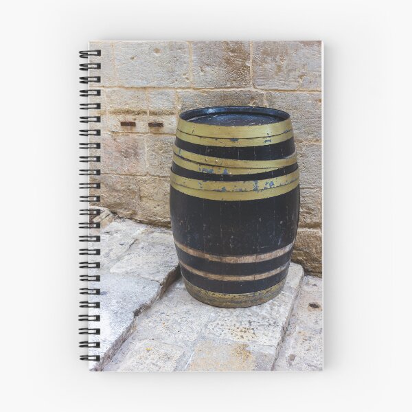 Item preview, Rustic Wooden Barrel Against Weathered Stone Wall On Old Cobblestone Street designed and sold by Nmallia.