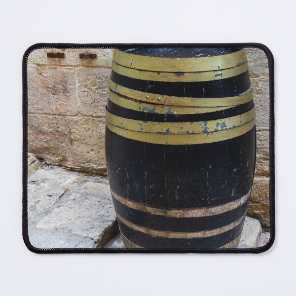 Item preview, Rustic Wooden Barrel Against Weathered Stone Wall On Old Cobblestone Street designed and sold by Nmallia.