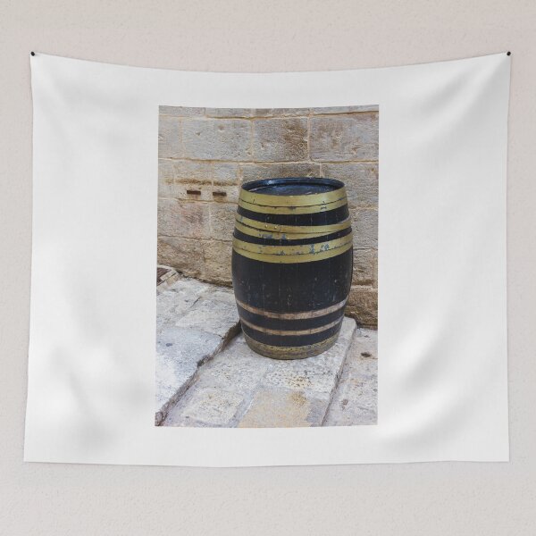 Item preview, Rustic Wooden Barrel Against Weathered Stone Wall On Old Cobblestone Street designed and sold by Nmallia.
