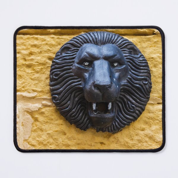 Item preview, Black Lion Head Sculpture Mounted on Yellow Stone Wall, Vintage Architectural Decorative Detail designed and sold by Nmallia.