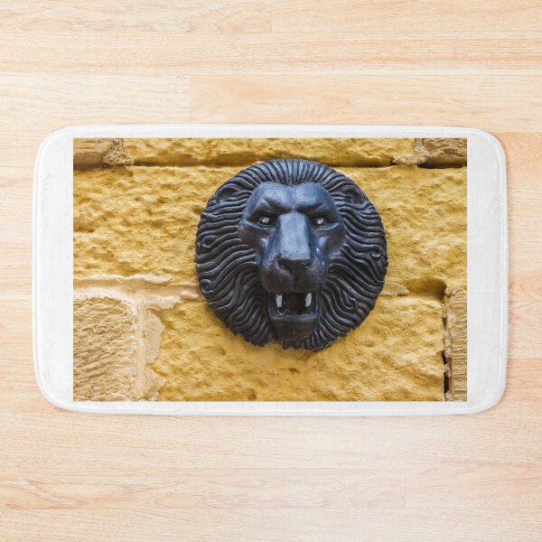 Item preview, Black Lion Head Sculpture Mounted on Yellow Stone Wall, Vintage Architectural Decorative Detail designed and sold by Nmallia.