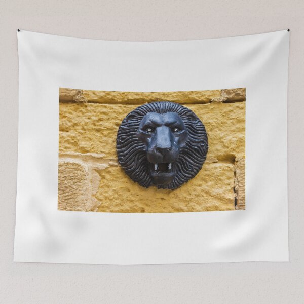 Item preview, Black Lion Head Sculpture Mounted on Yellow Stone Wall, Vintage Architectural Decorative Detail designed and sold by Nmallia.