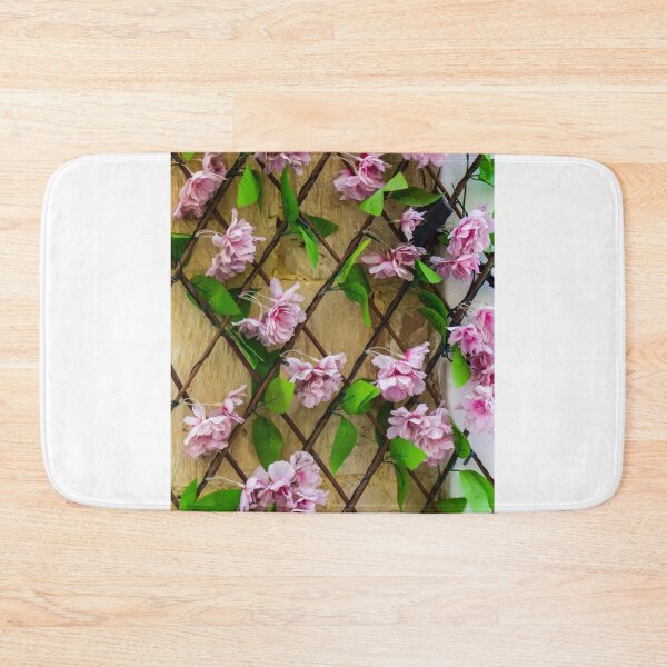 Item preview, Pink Artificial Flowers On Wooden Trellis Against Stone Wall Decorative Floral Display For Home designed and sold by Nmallia.