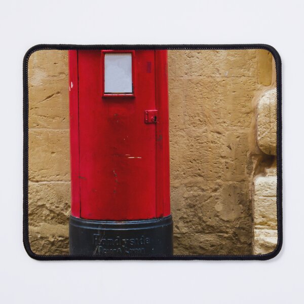 Item preview, Red Post Box Against Stone Wall on Historic British Street, Vintage Mailbox and Postal Charm designed and sold by Nmallia.