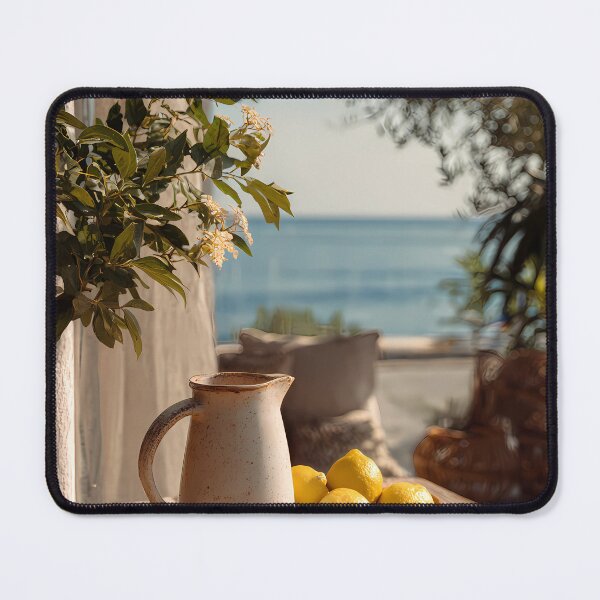 Item preview, Rustic Mediterranean Terrace with Lemon Pitcher and Sea View Art Print designed and sold by Emberearth.