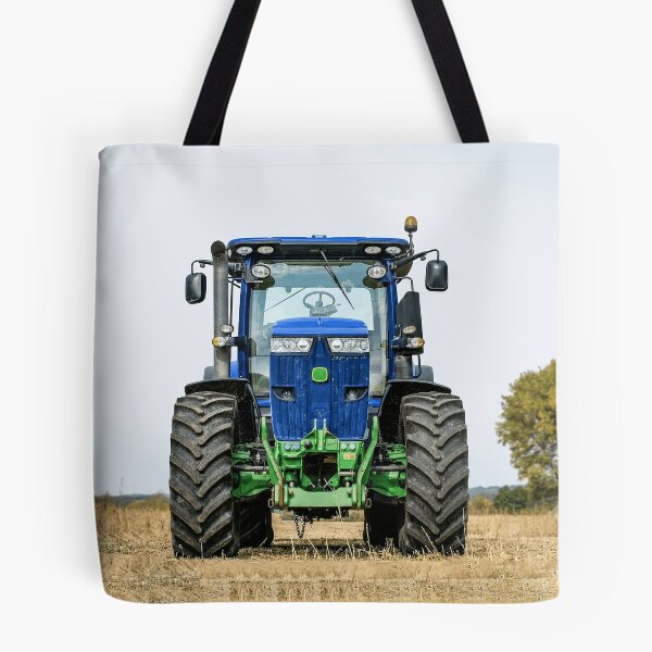 Item preview, Blue agricultural tractor in the field: powerful agricultural machine for farming. designed and sold by Mahilis.