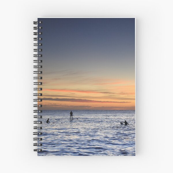 Item preview, Surfers and a stand-up paddleboarder enjoying the sunrise at Cabarita beach designed and sold by Rachel Elizabeth Photography.