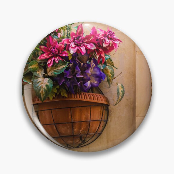 Item preview, Pink And Purple Flowers In Terracotta Wall Planter Pot Against Textured Beige Stucco Wall designed and sold by Nmallia.