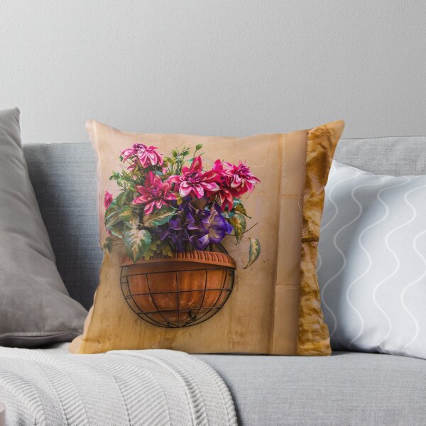 Item preview, Pink And Purple Flowers In Terracotta Wall Planter Pot Against Textured Beige Stucco Wall designed and sold by Nmallia.