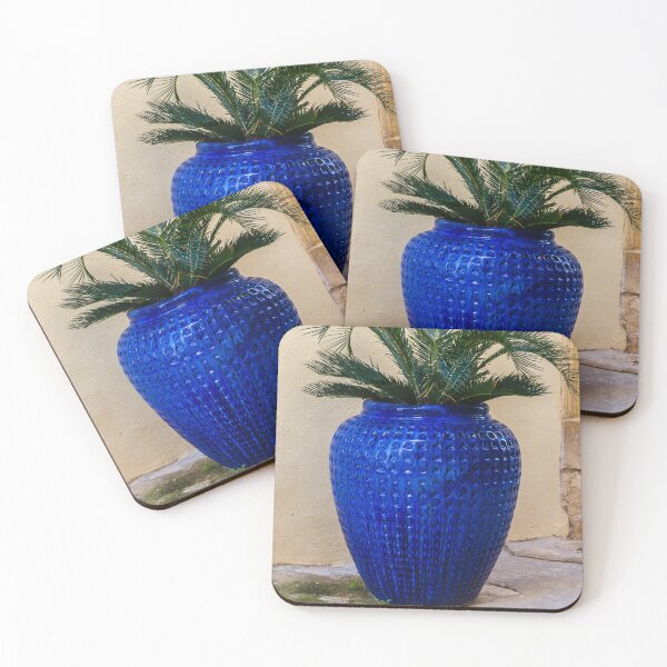 Item preview, Blue Ceramic Vase With Tropical Palm Plant Used As Decorative Outdoor Planter By A Stucco Wall designed and sold by Nmallia.