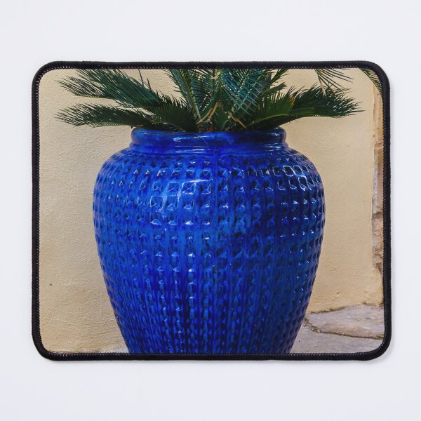 Item preview, Blue Ceramic Vase With Tropical Palm Plant Used As Decorative Outdoor Planter By A Stucco Wall designed and sold by Nmallia.