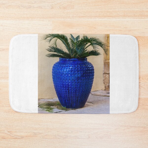 Item preview, Blue Ceramic Vase With Tropical Palm Plant Used As Decorative Outdoor Planter By A Stucco Wall designed and sold by Nmallia.