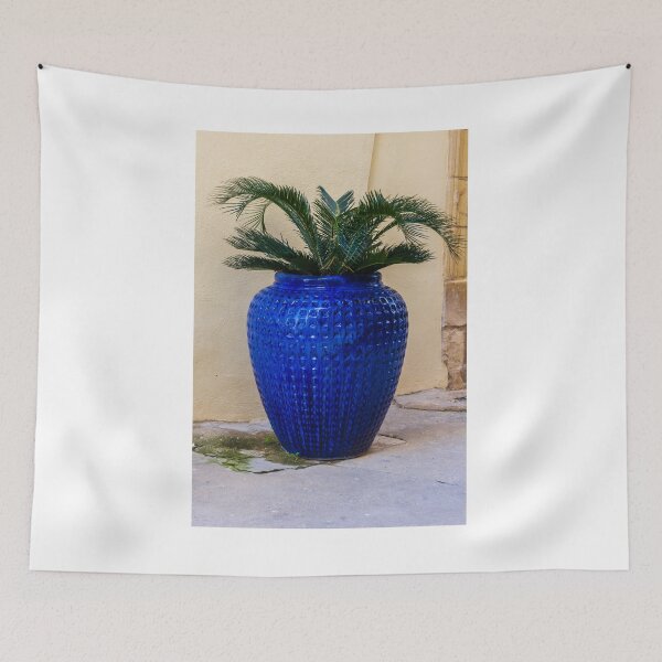 Item preview, Blue Ceramic Vase With Tropical Palm Plant Used As Decorative Outdoor Planter By A Stucco Wall designed and sold by Nmallia.
