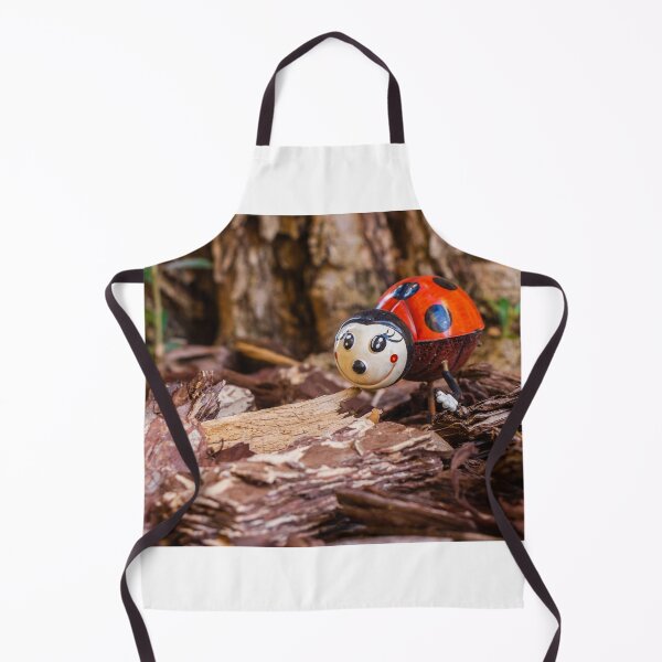 Item preview, Decorative Ladybug Figurine Amid Wooden Chips and Natural Outdoor Setting designed and sold by Nmallia.