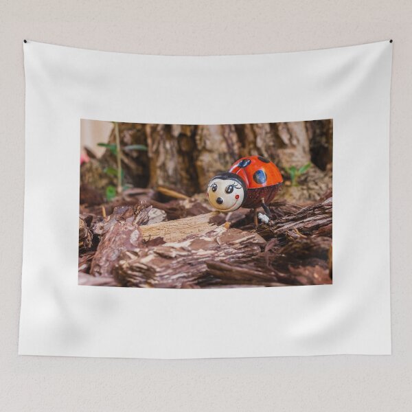 Item preview, Decorative Ladybug Figurine Amid Wooden Chips and Natural Outdoor Setting designed and sold by Nmallia.