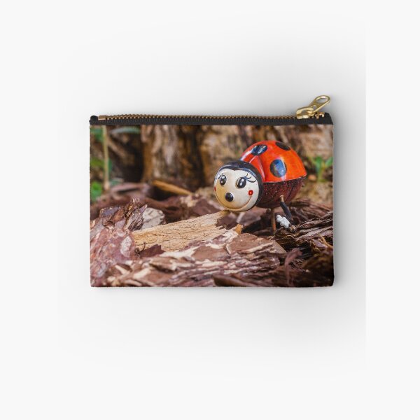 Item preview, Decorative Ladybug Figurine Amid Wooden Chips and Natural Outdoor Setting designed and sold by Nmallia.
