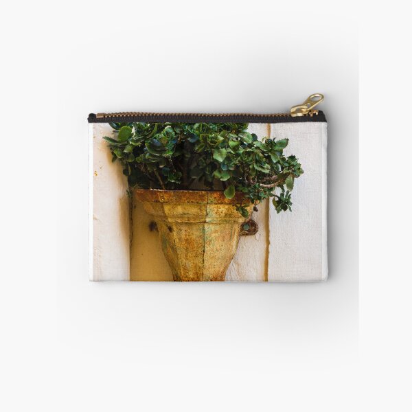 Item preview, Rustic Wall Planter With Green Succulent Plants Against A Weathered Cream Stucco Wall designed and sold by Nmallia.