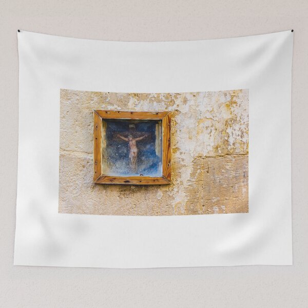 Item preview, Weathered Framed Crucifix On Old Plastered Wall Religious Icon Shrine In Rustic Street Scene designed and sold by Nmallia.