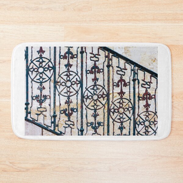 Item preview, Ornate Rusted Iron Railing With Vintage Decorative Stair Balusters Against Stone Wall designed and sold by Nmallia.