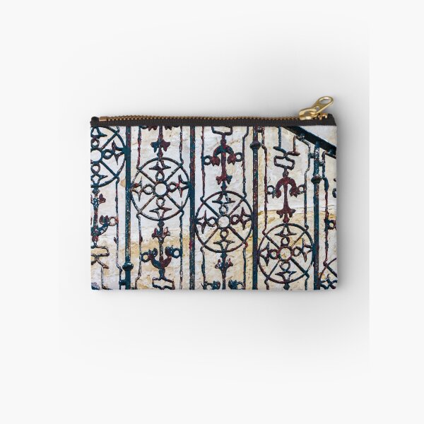 Item preview, Ornate Rusted Iron Railing With Vintage Decorative Stair Balusters Against Stone Wall designed and sold by Nmallia.