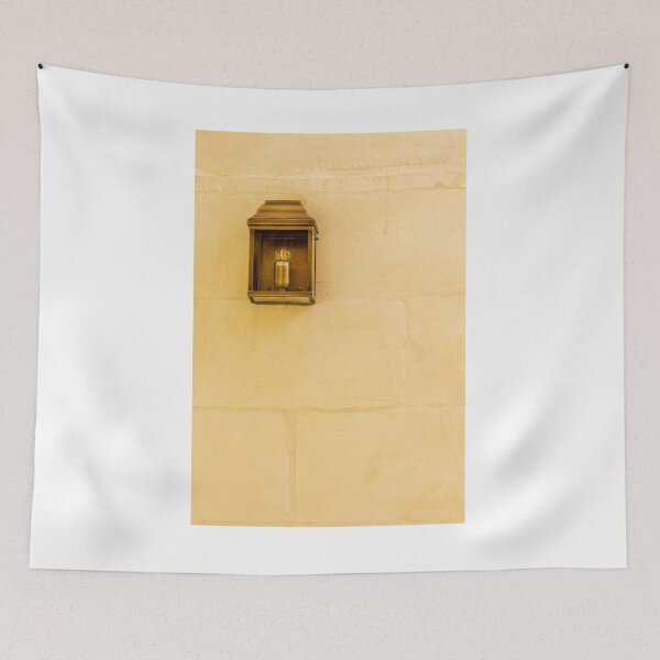 Item preview, Vintage Wall Lantern Closeup On Warm Stone Wall, Minimal Exterior Lighting And Architectural Texture designed and sold by Nmallia.