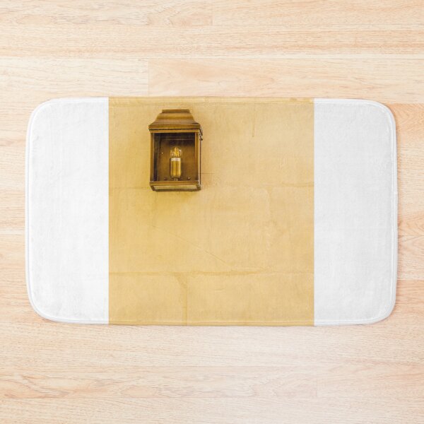 Item preview, Vintage Wall Lantern Closeup On Warm Stone Wall, Minimal Exterior Lighting And Architectural Texture designed and sold by Nmallia.