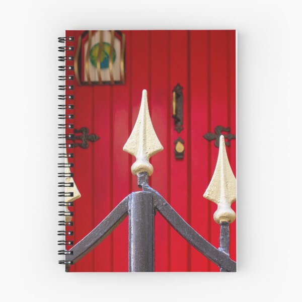 Item preview, Decorative Iron Gate With Gold Finials Guarding a Bright Red Wooden Door Entrance of Historic Home designed and sold by Nmallia.