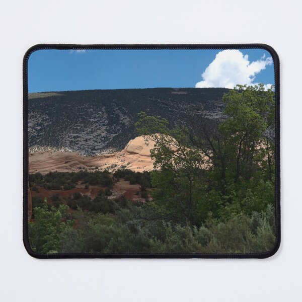 Item preview, Dinosaur National Monument formation bathed in sun spotlight amidst trees designed and sold by lisavonbiela.