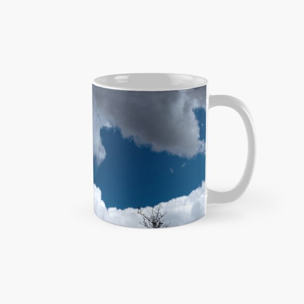Item preview, Bare treetops silhouetted against massive cumulus clouds with trails designed and sold by lisavonbiela.